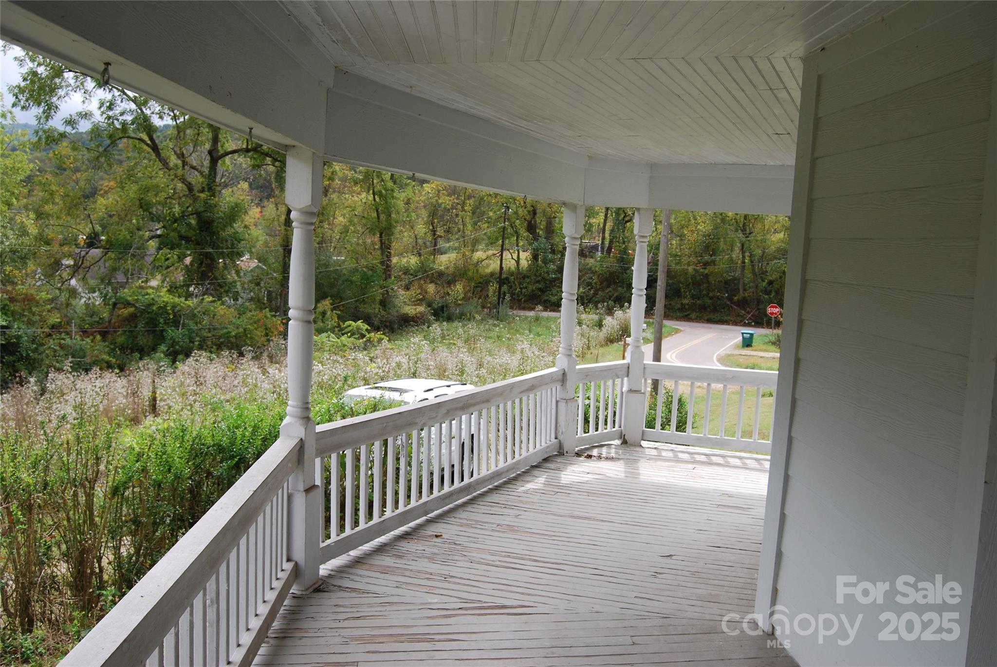 7 Noble Road Fairview, NC 28730 - Photo 16 of 44 a view of a balcony with wooden floor