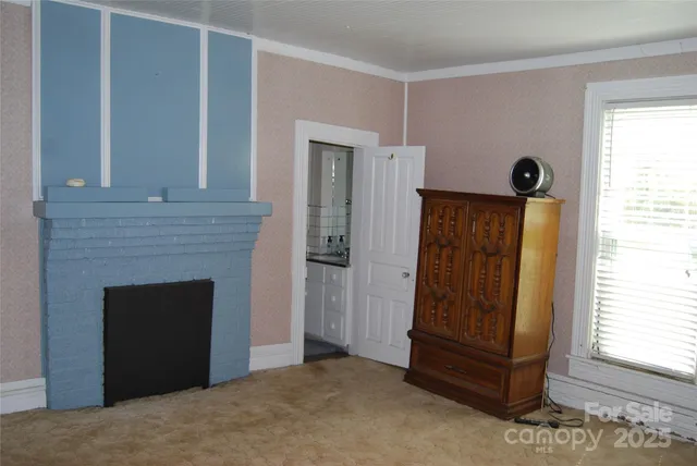 a view of a entryway door with wooden floor