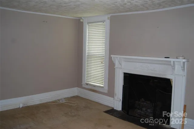 a kitchen with stainless steel appliances granite countertop a sink a stove and a microwave