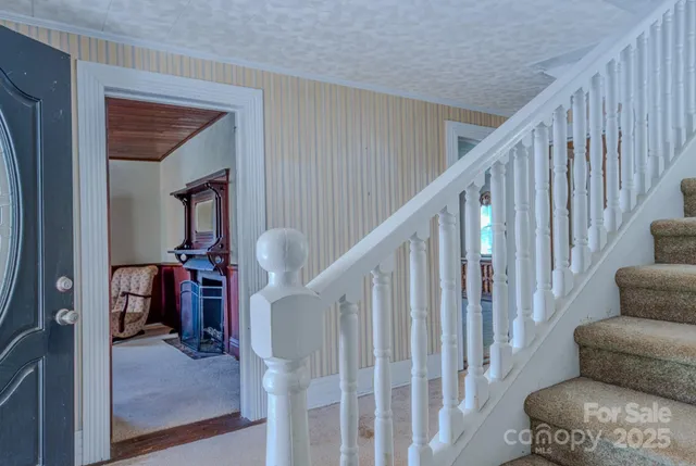 a view of an empty room with a fireplace