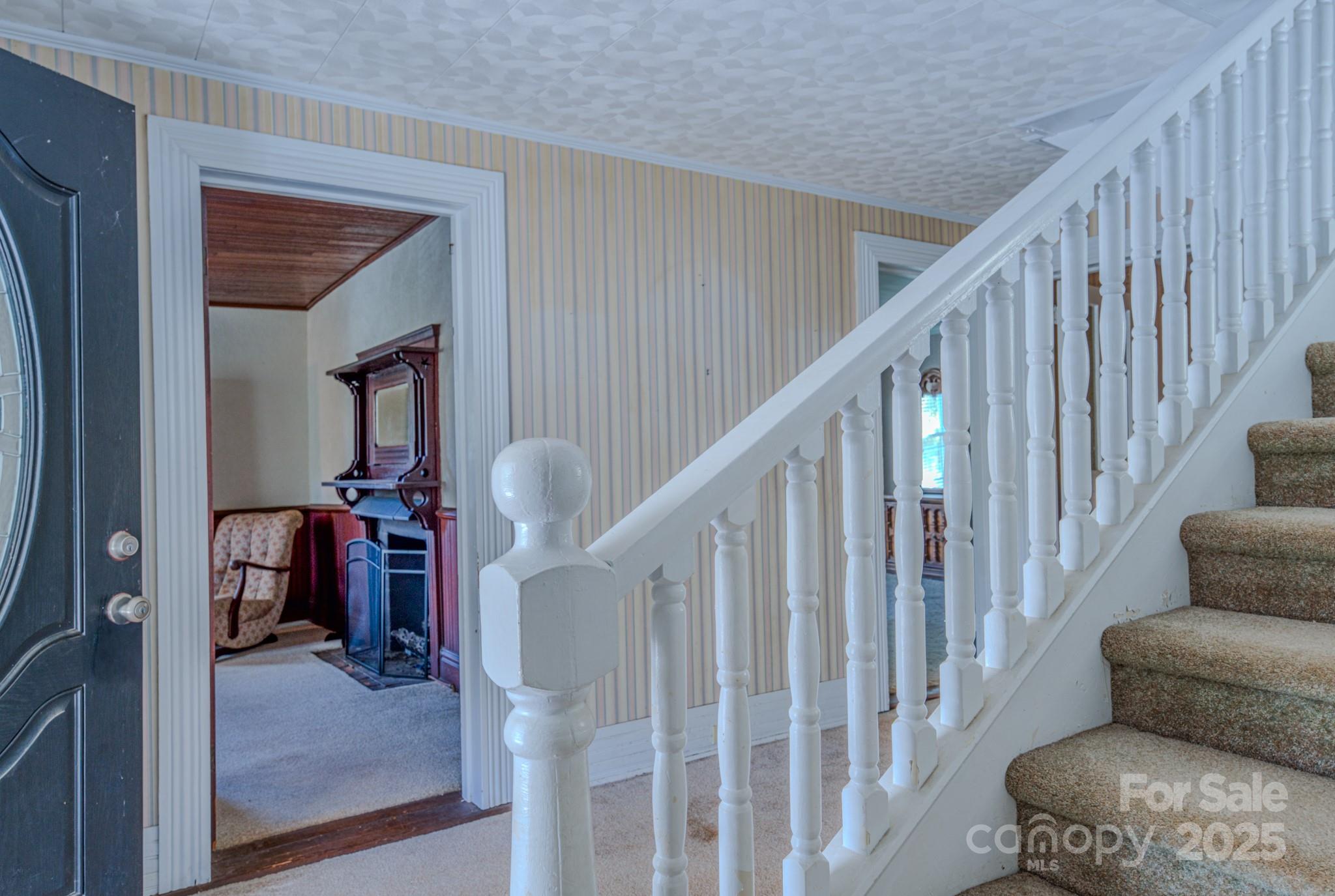 7 Noble Road Fairview, NC 28730 - Photo 32 of 44 a view of livingroom with furniture and stairs