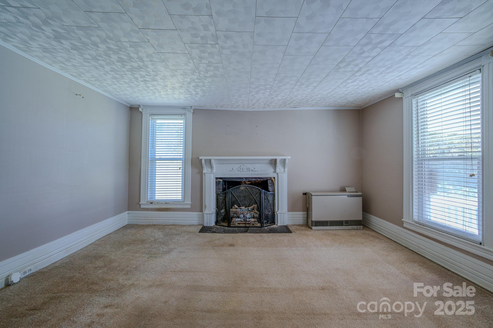 7 Noble Road Fairview, NC 28730 - Photo 34 of 44 a view of an empty room with a fireplace