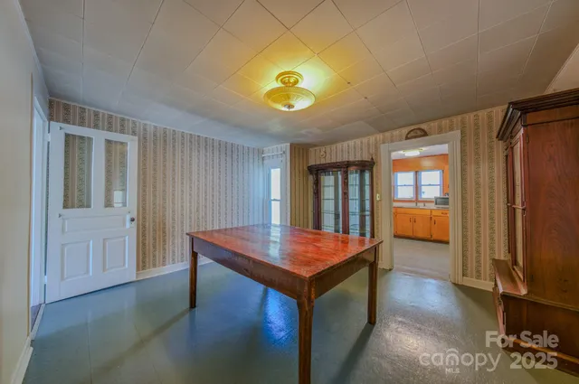 a kitchen with granite countertop cabinets sink and window