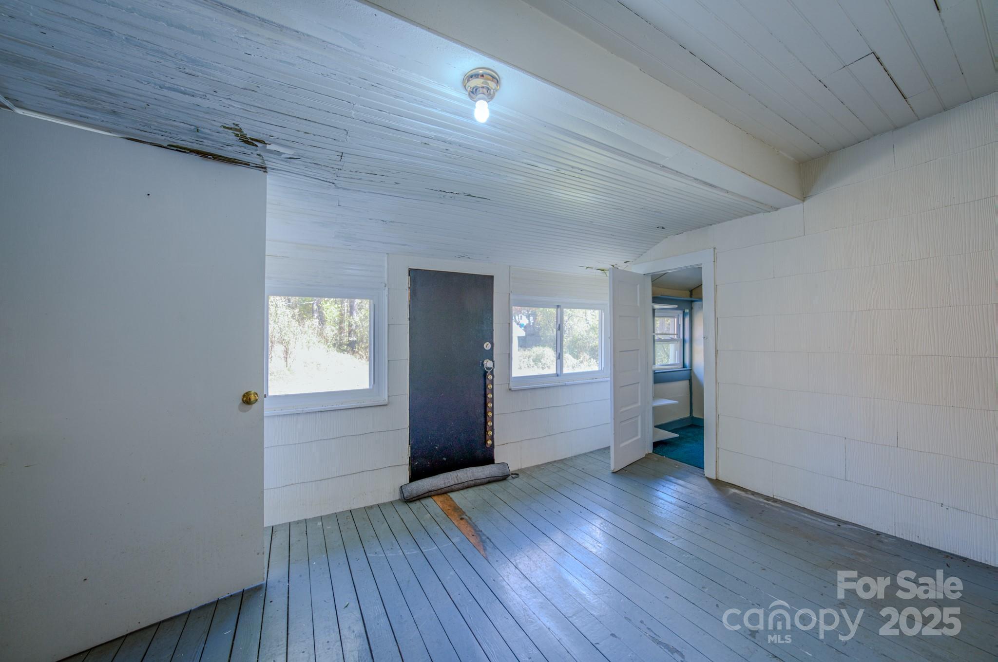 7 Noble Road Fairview, NC 28730 - Photo 38 of 44 wooden floor in an empty room with a window