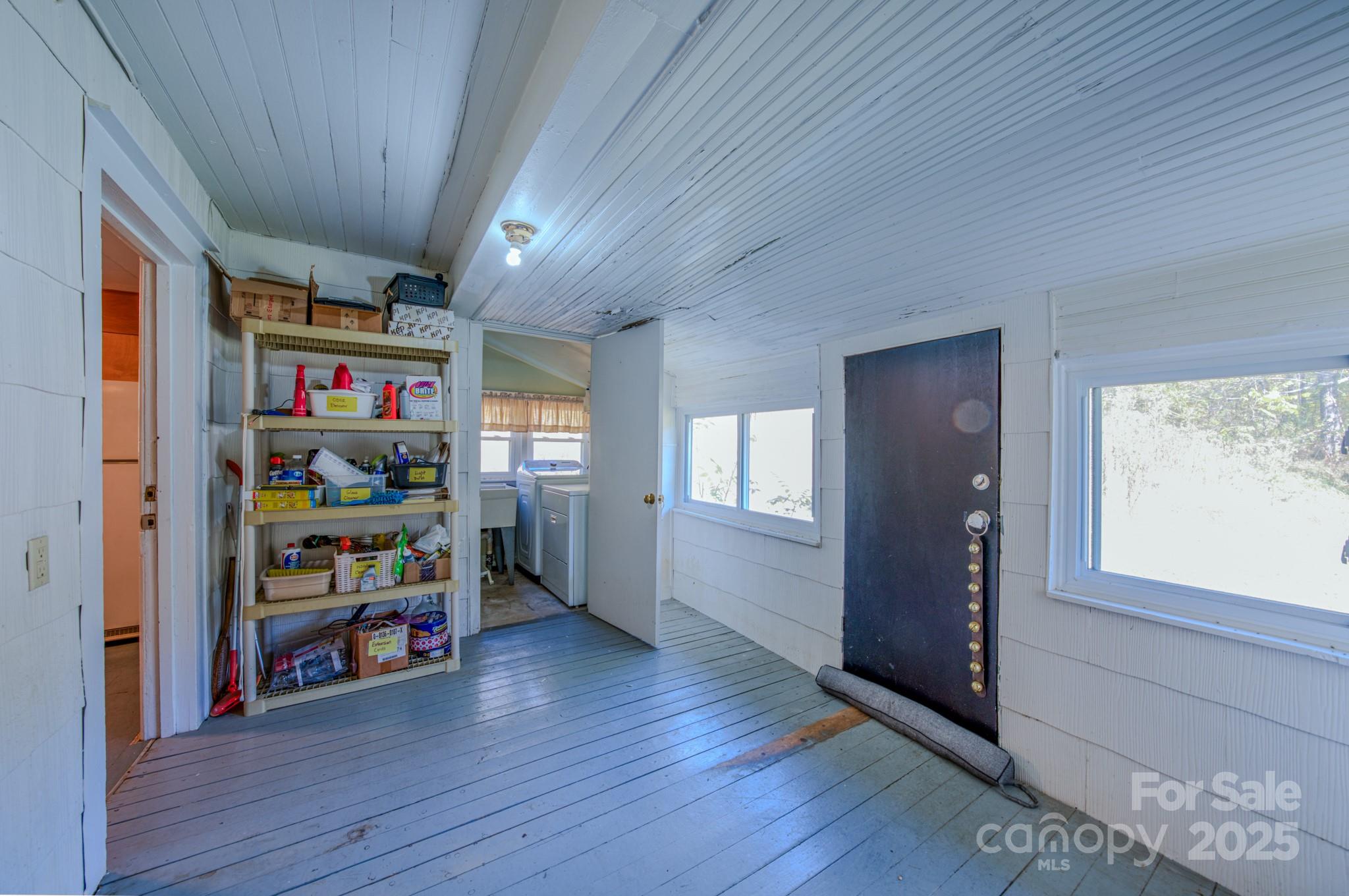 7 Noble Road Fairview, NC 28730 - Photo 39 of 44 a view of a hallway with wooden floor and closet