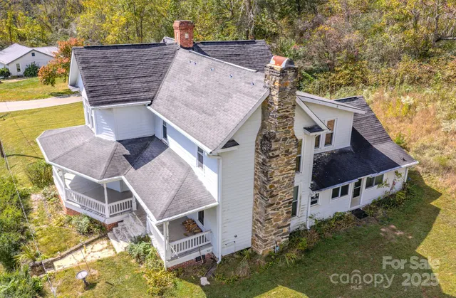 an aerial view of a house with swimming pool