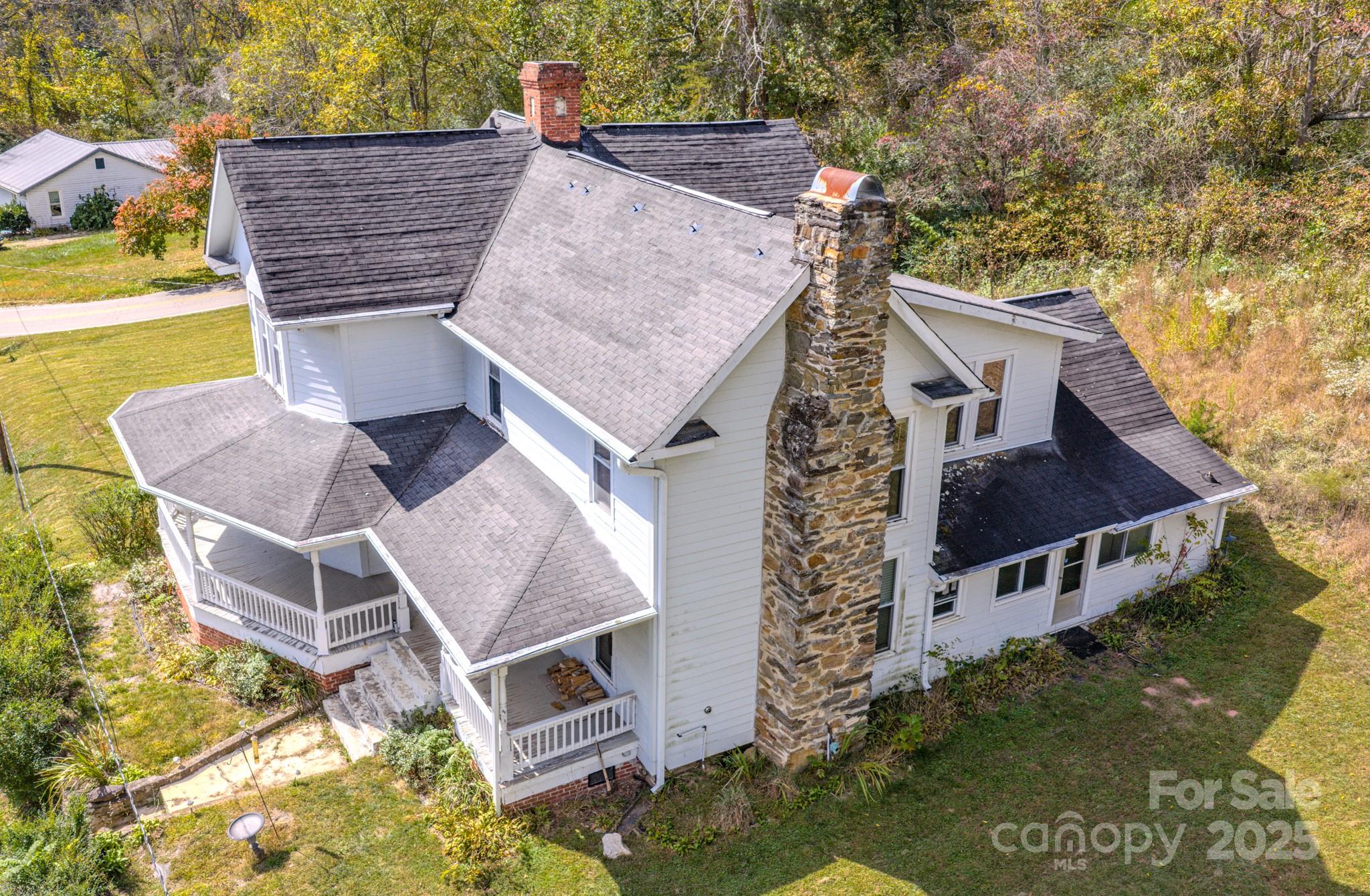 7 Noble Road Fairview, NC 28730 - Photo 6 of 44 an aerial view of a house with swimming pool