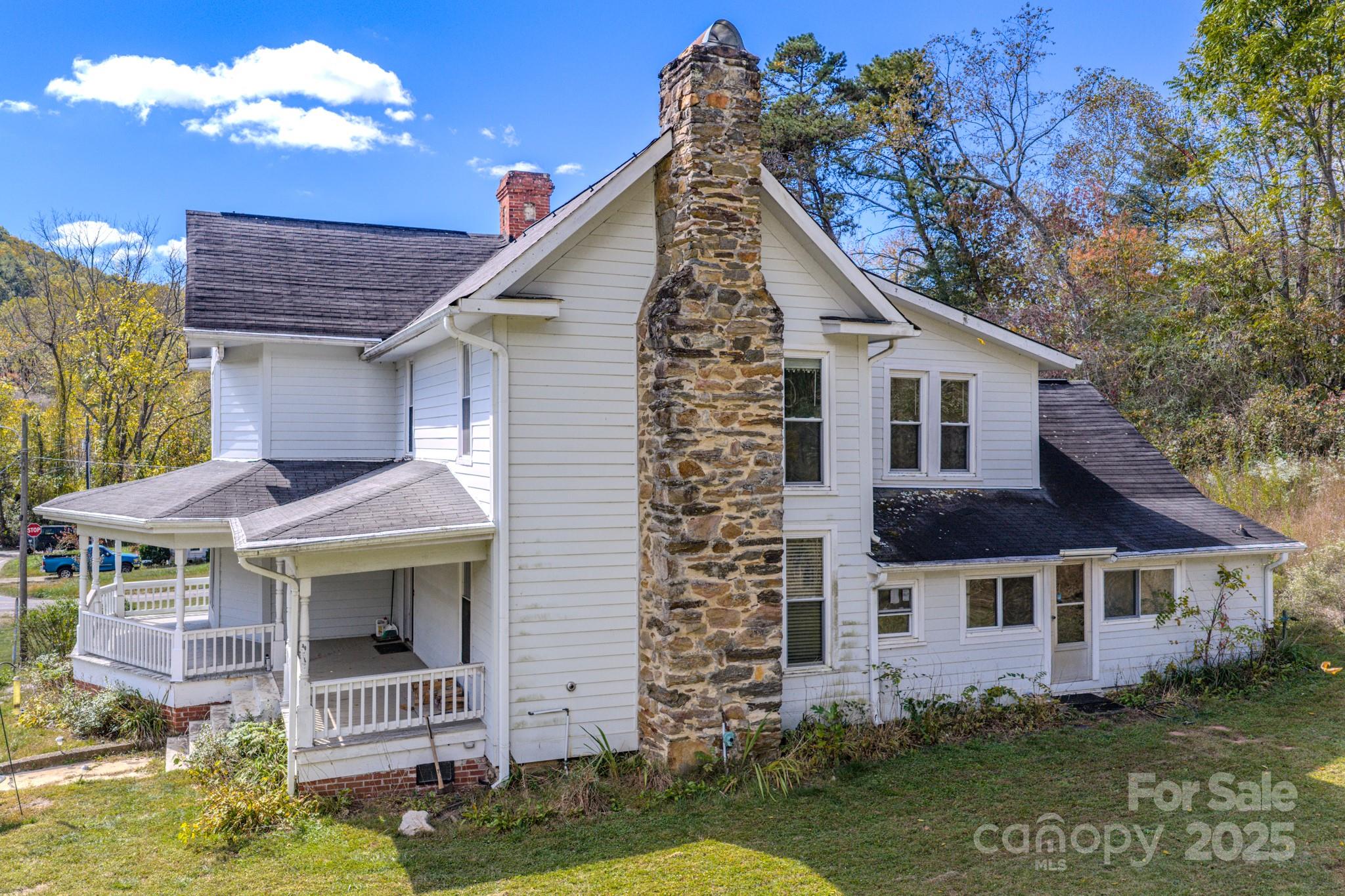 7 Noble Road Fairview, NC 28730 - Photo 7 of 44 a view of a house with garden
