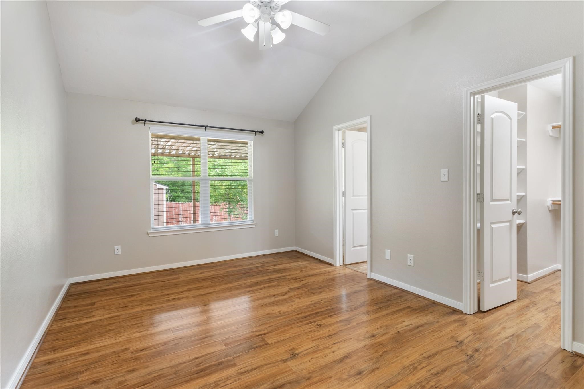 2023 Mountain Wind Loop Bryan, TX 77807 - Photo 9 of 16 a view of an empty room with wooden floor and a window