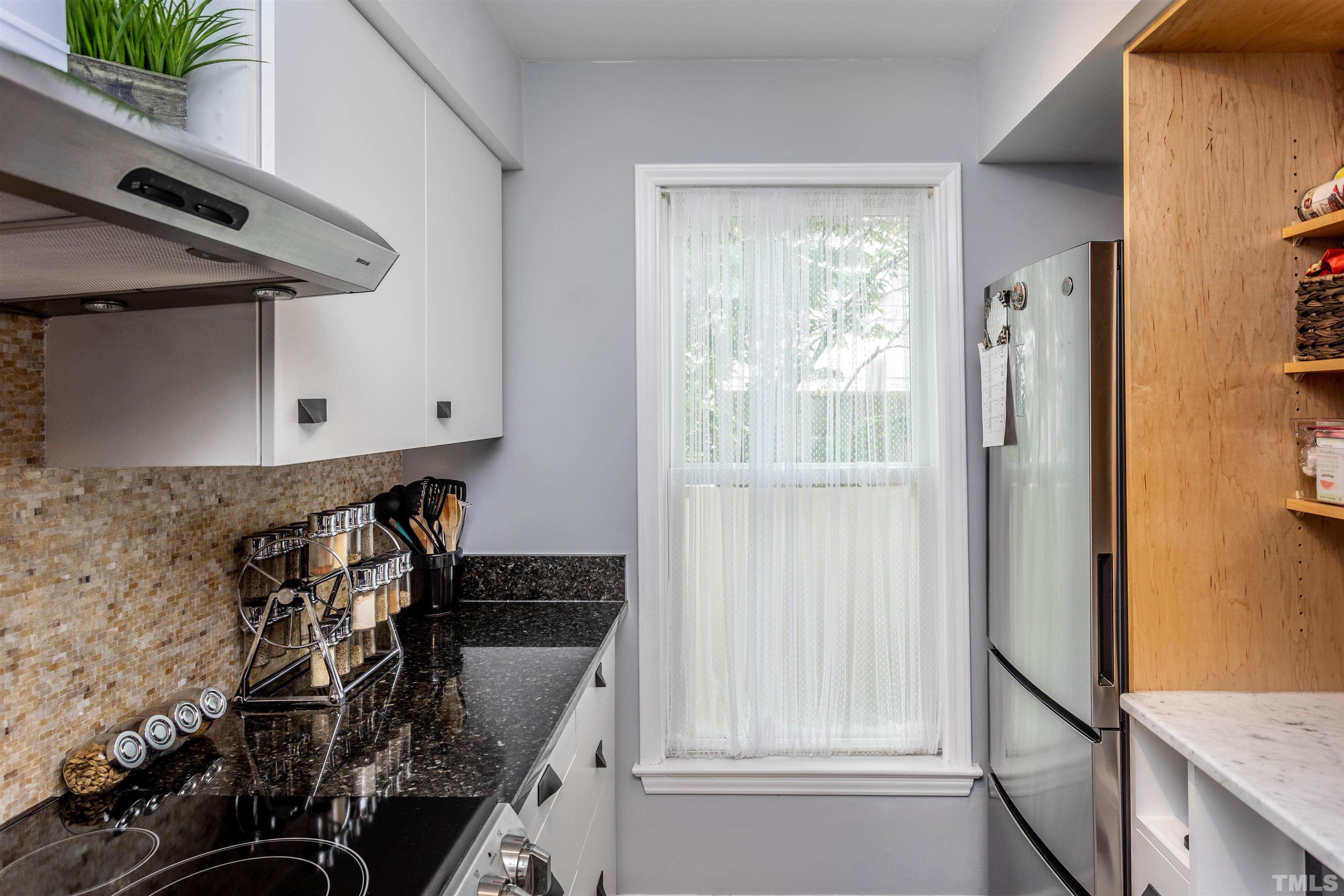 1024 Brighthurst Drive Raleigh, NC 27605 - Photo 4 of 26 a close view of a sink and a mirror