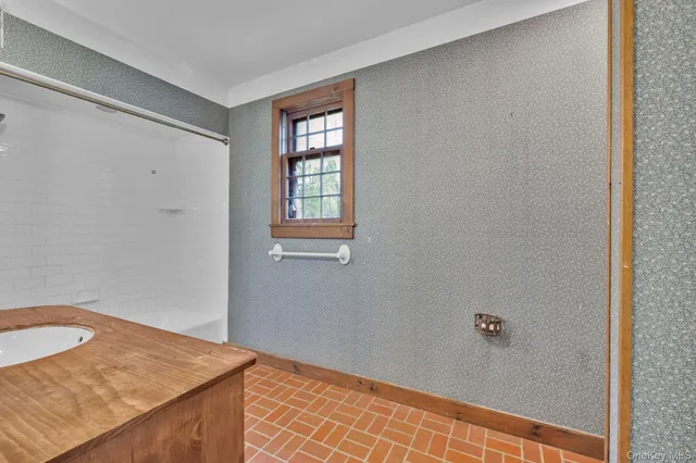 a view of a house with sitting area and garden