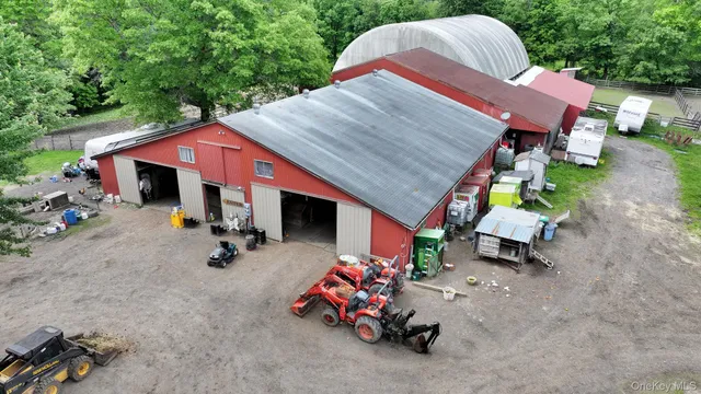 a view of backyard with outdoor seating and trees