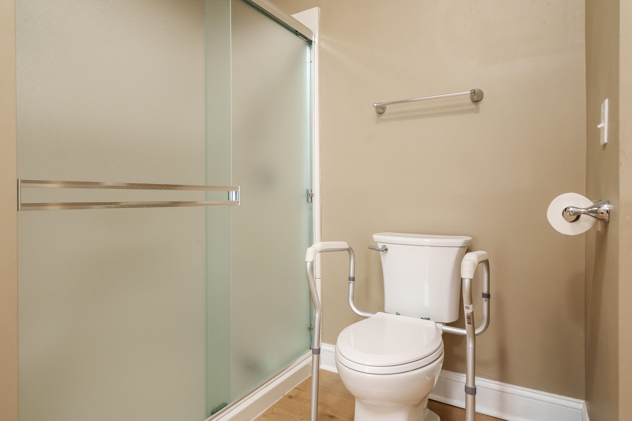 720 South 2nd Street DeKalb, IL 60115 - Photo 16 of 20 a bathroom with a toilet and a shower