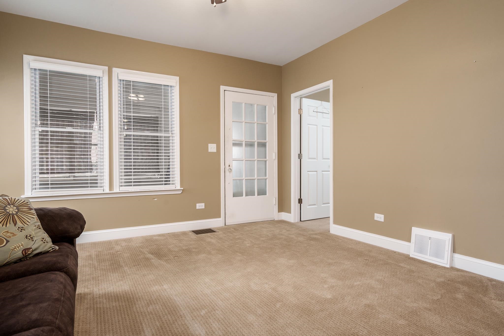 720 South 2nd Street DeKalb, IL 60115 - Photo 4 of 20 a view of livingroom with a large window