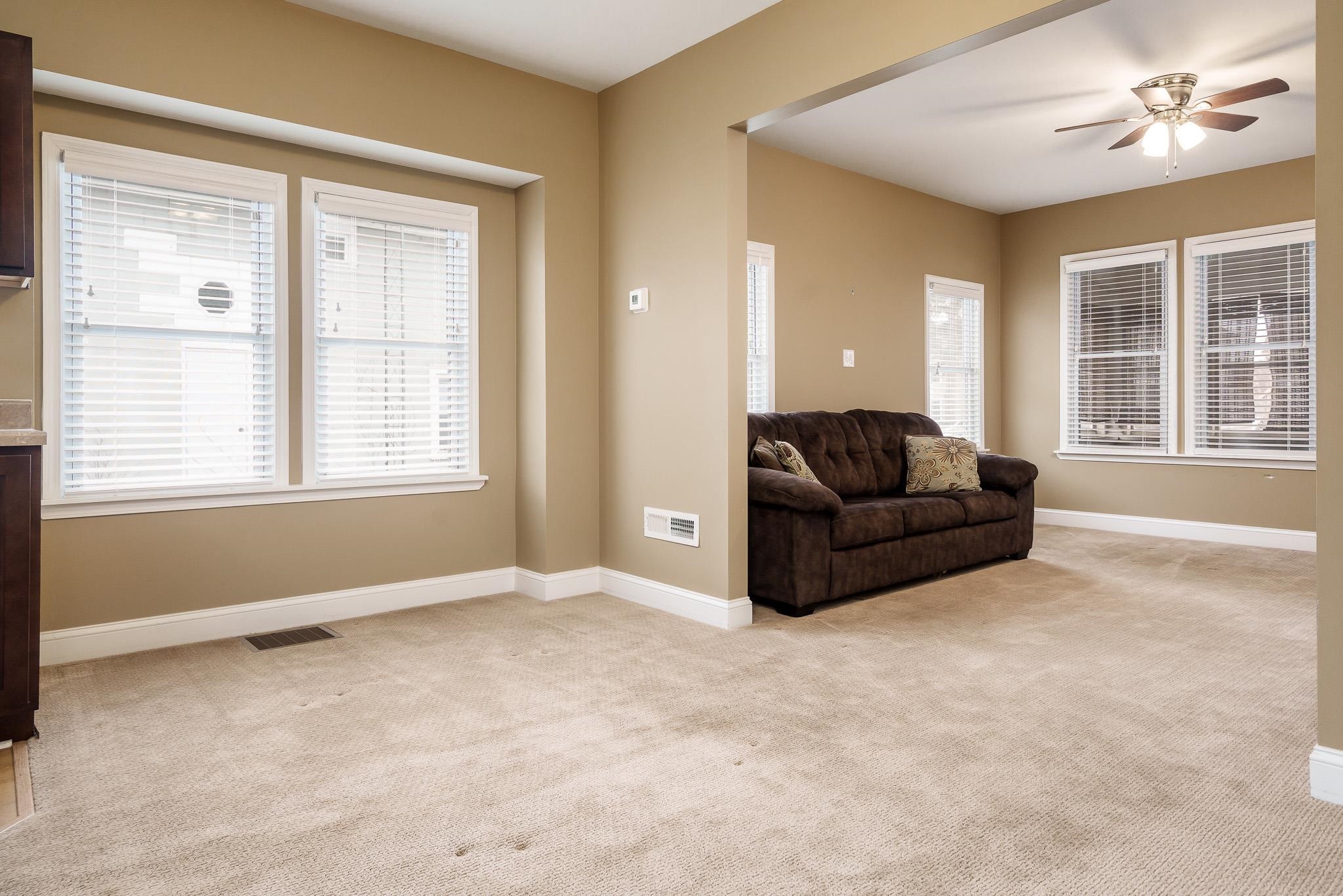 720 South 2nd Street DeKalb, IL 60115 - Photo 6 of 20 a living room with furniture and a window