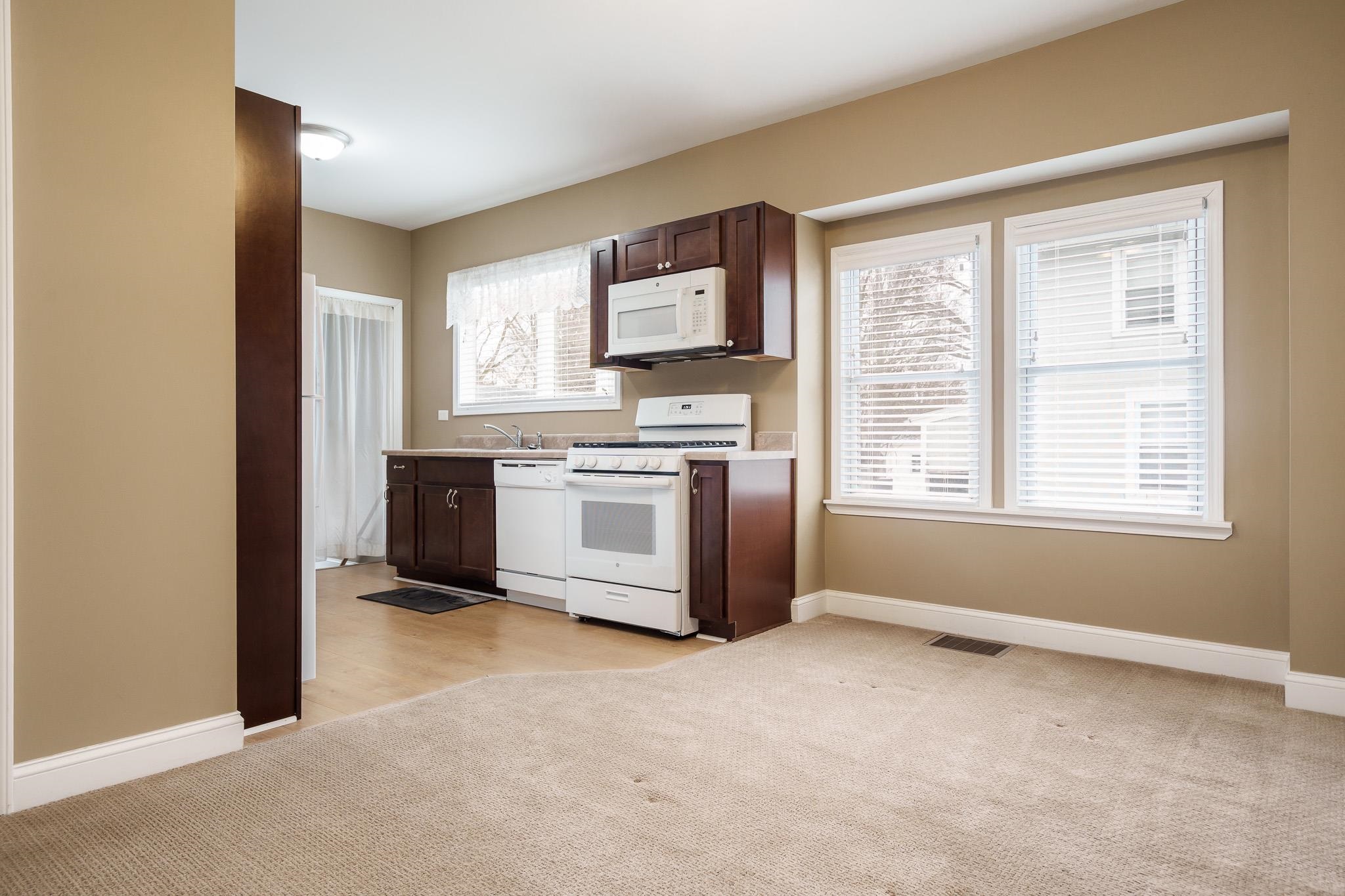 720 South 2nd Street DeKalb, IL 60115 - Photo 7 of 20 a view of a kitchen with a stove top oven