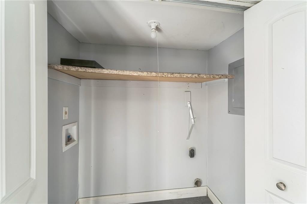 18 Quail Run, Unit A Decatur, GA 30035 - Photo 14 of 28 a bathroom with a glass shower door