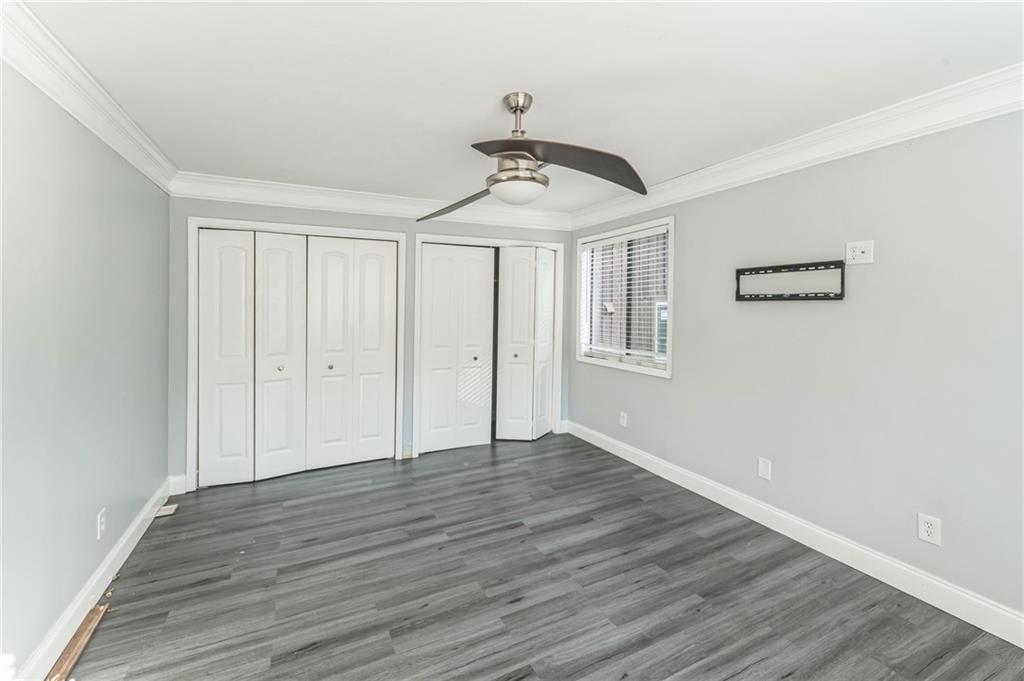 18 Quail Run, Unit A Decatur, GA 30035 - Photo 16 of 28 a view of an empty room with wooden floor