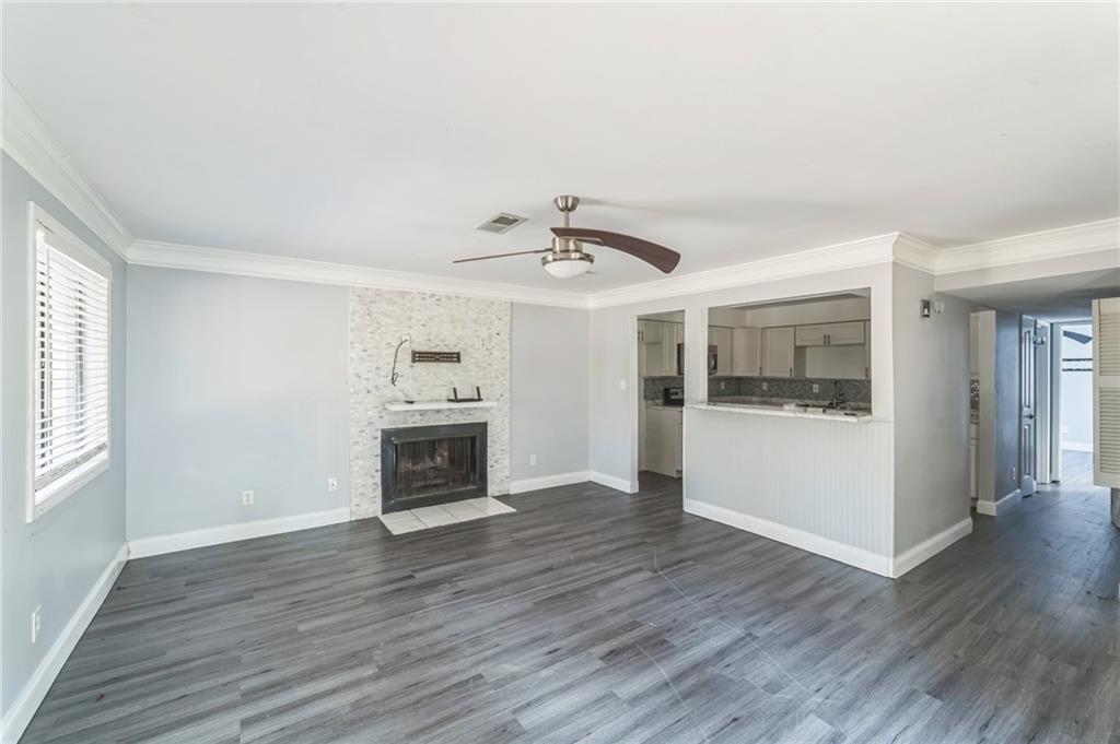 18 Quail Run, Unit A Decatur, GA 30035 - Photo 2 of 28 a view of an empty room with a fireplace and a window