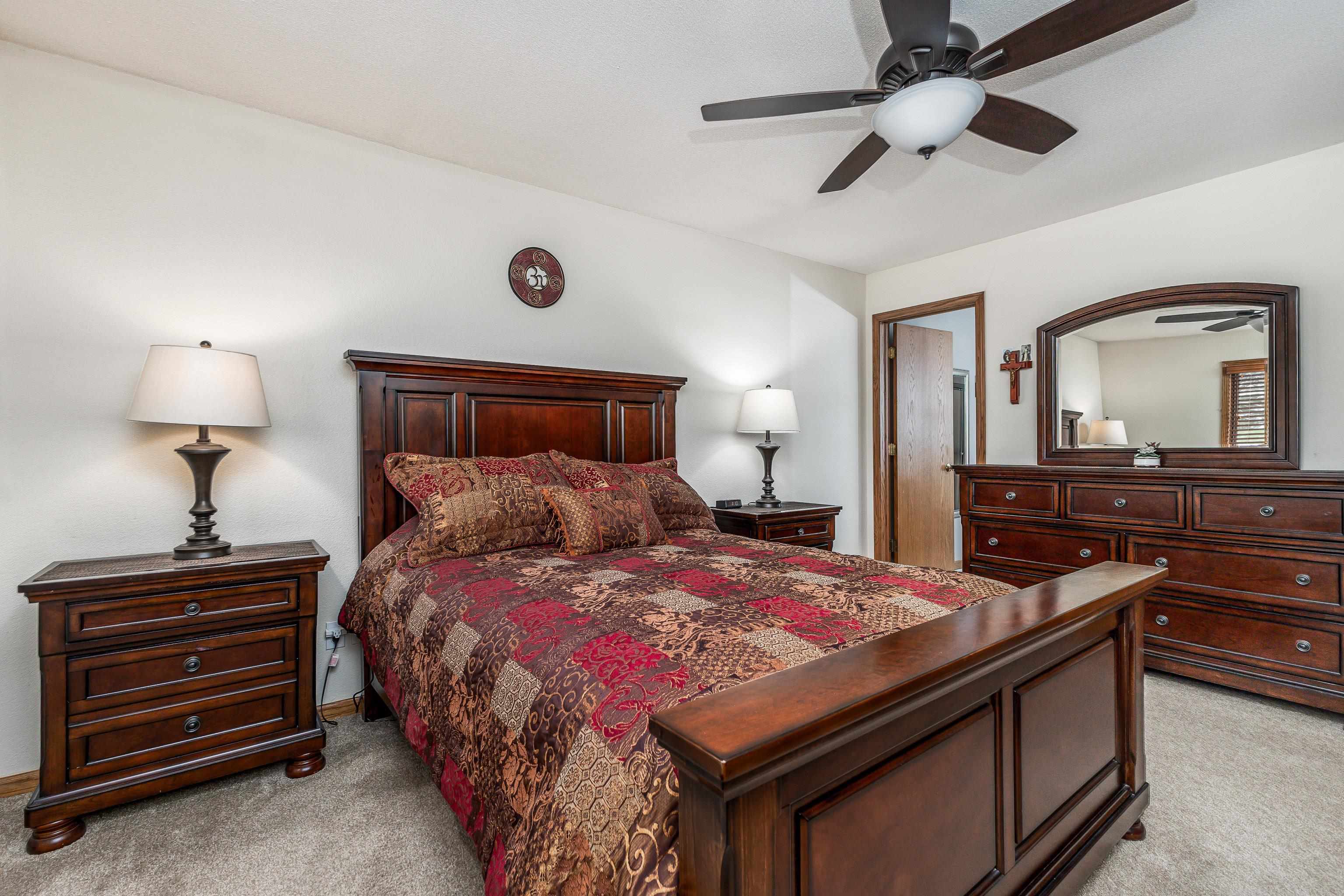 825 Shadow Bluff Drive Galena, IL 61036 - Photo 17 of 37 a bedroom with a bed and a dresser