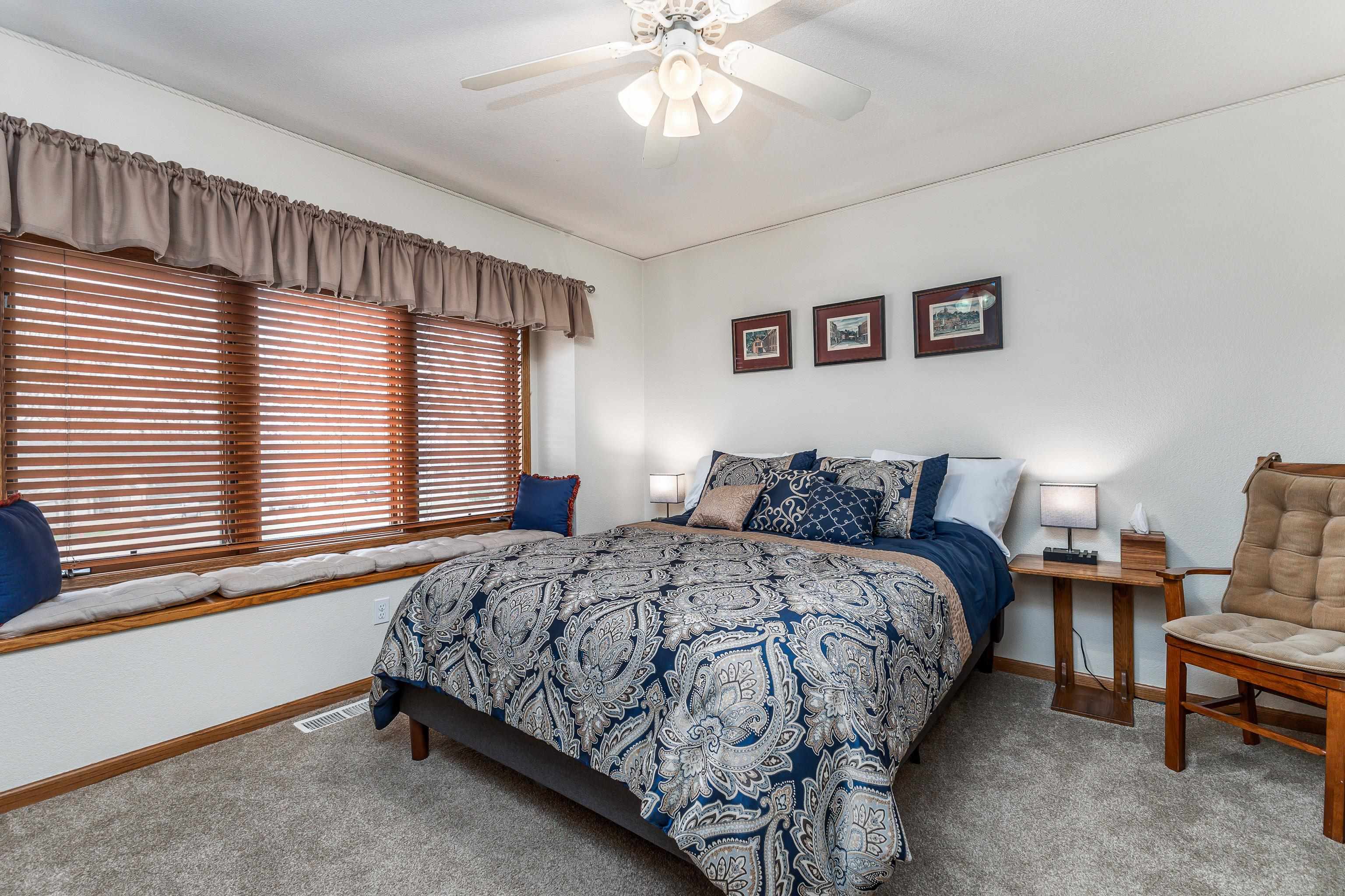 825 Shadow Bluff Drive Galena, IL 61036 - Photo 20 of 37 a bedroom with bed and window