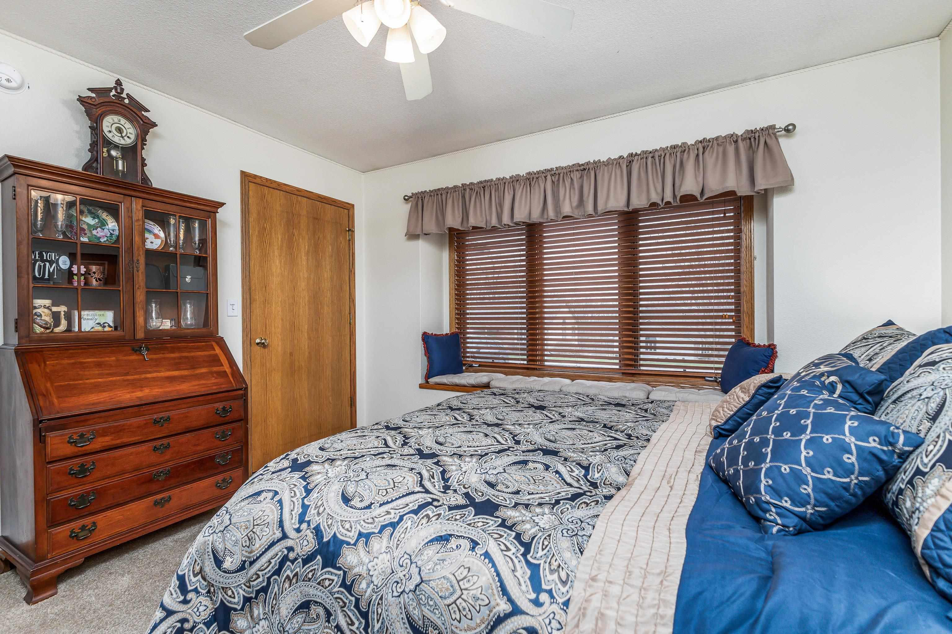 825 Shadow Bluff Drive Galena, IL 61036 - Photo 22 of 37 a bedroom with a bed and a dresser