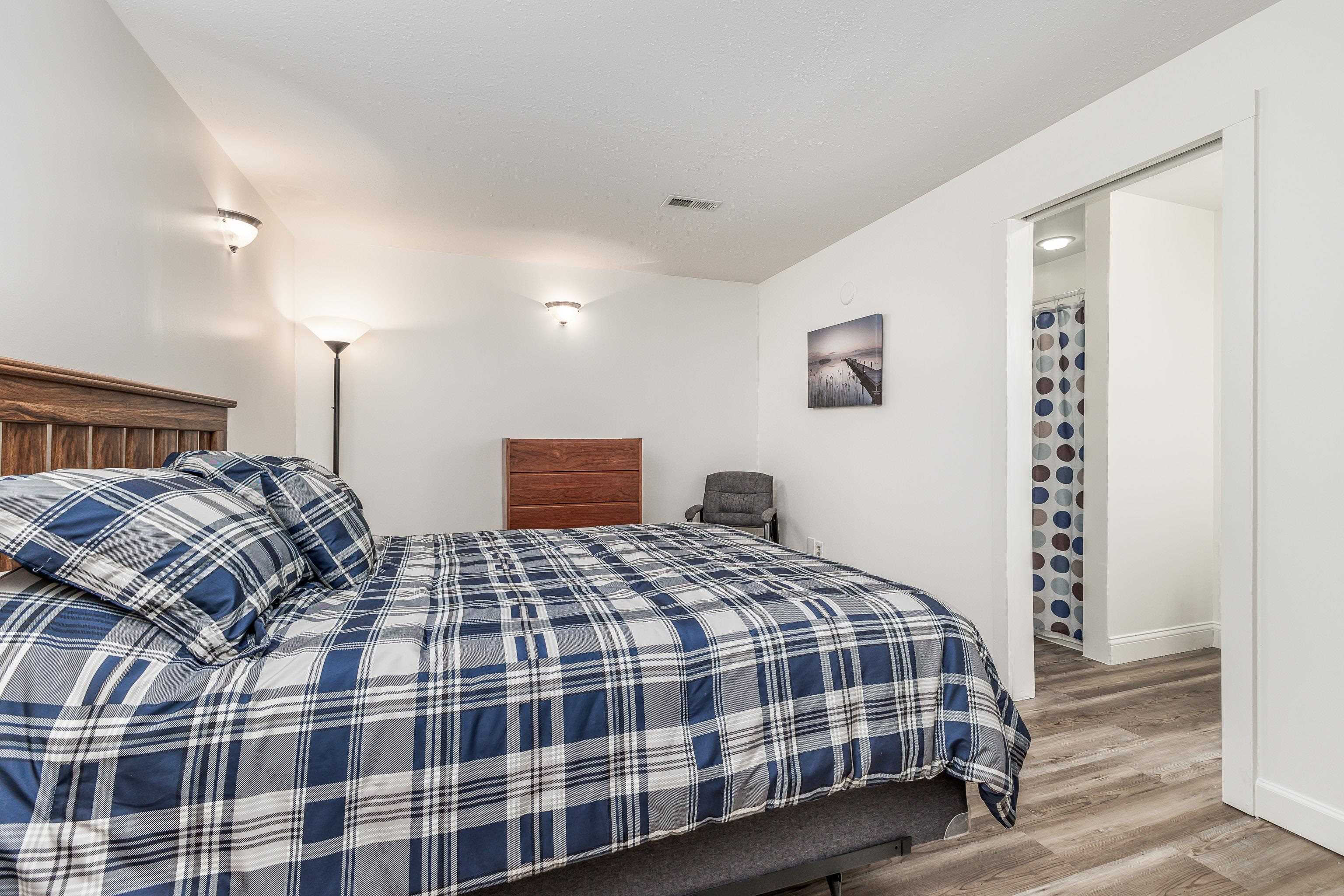 825 Shadow Bluff Drive Galena, IL 61036 - Photo 32 of 37 a bedroom with a bed and a night stand