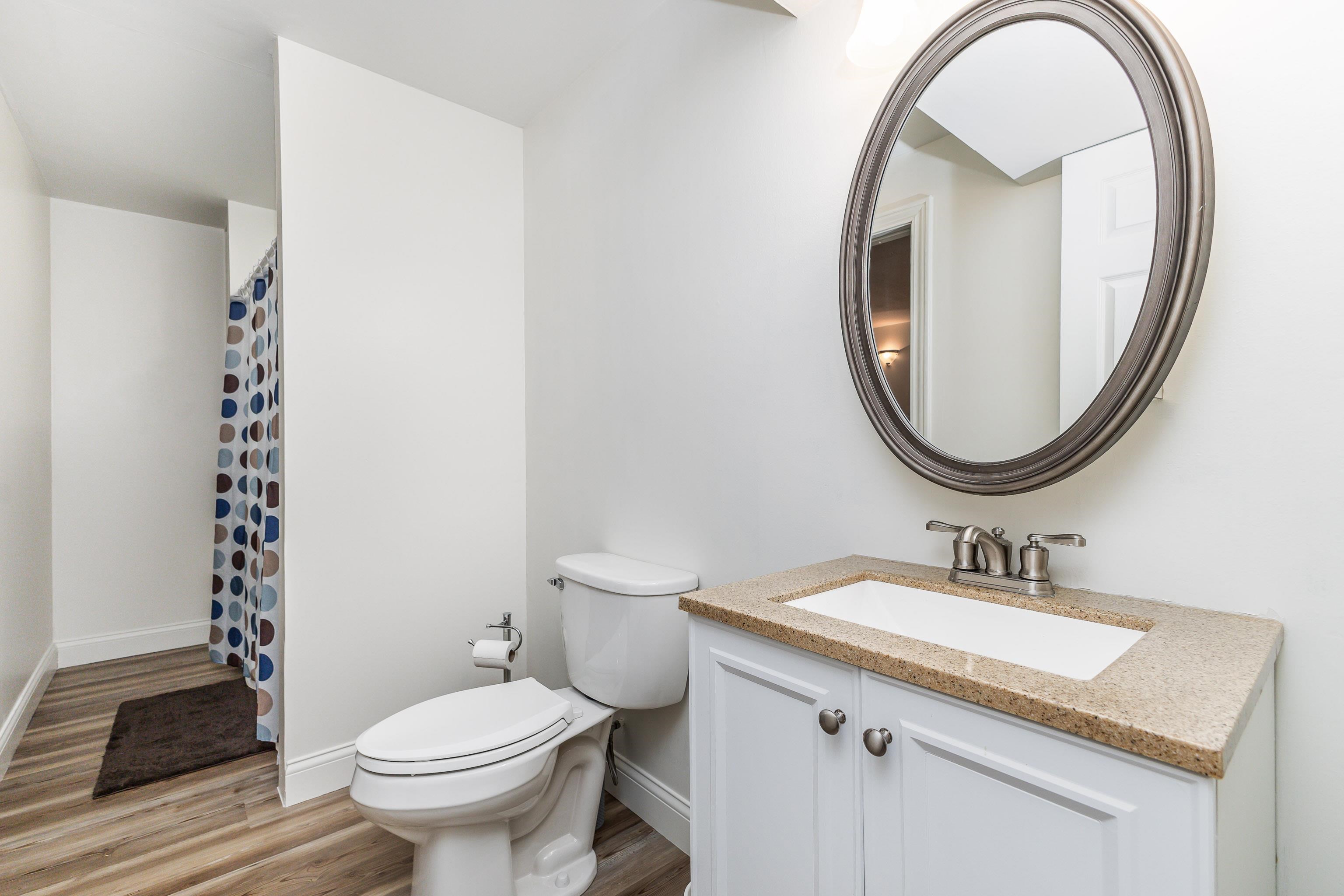825 Shadow Bluff Drive Galena, IL 61036 - Photo 33 of 37 a bathroom with a sink a toilet and a mirror