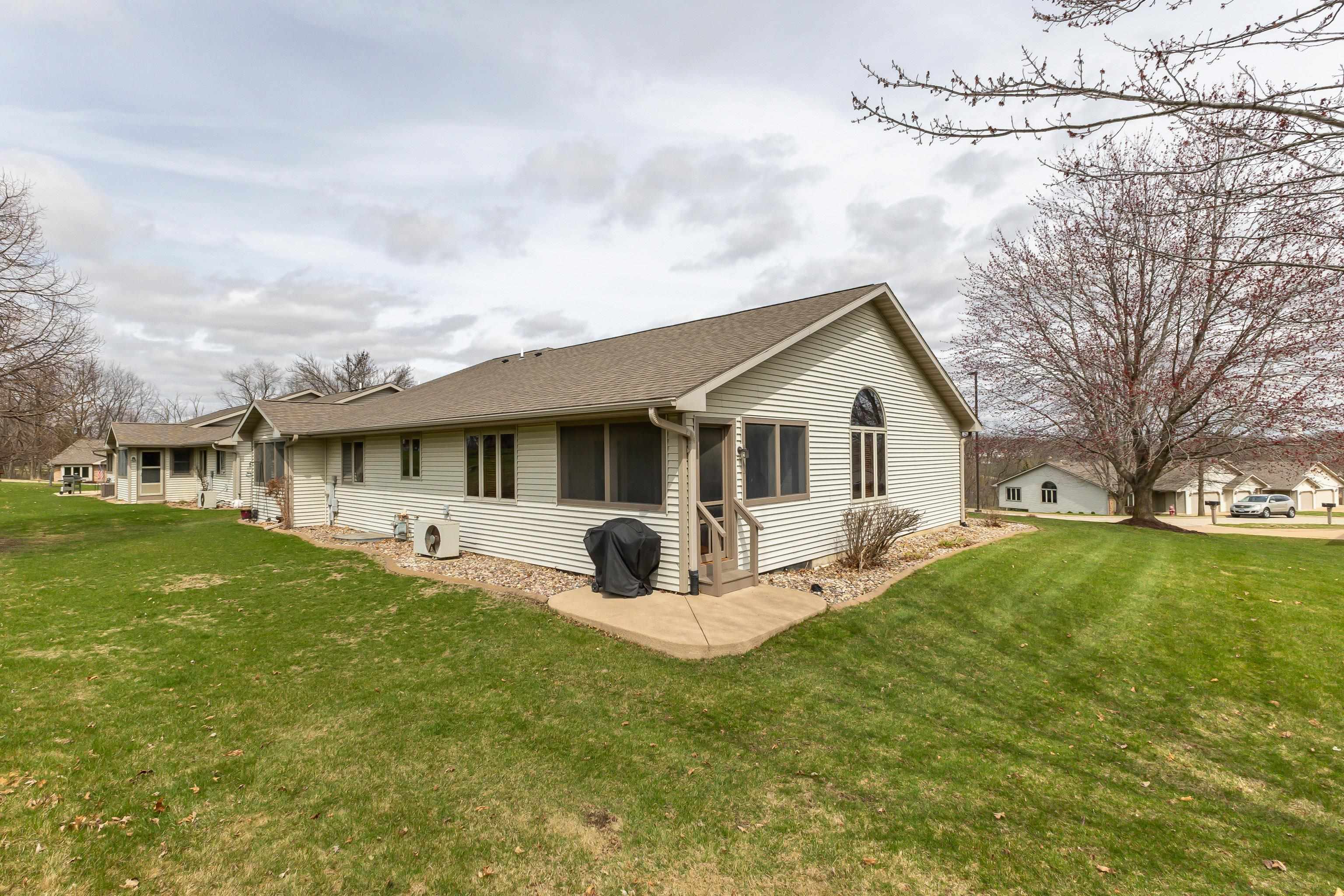 825 Shadow Bluff Drive Galena, IL 61036 - Photo 37 of 37 a front view of a house with garden