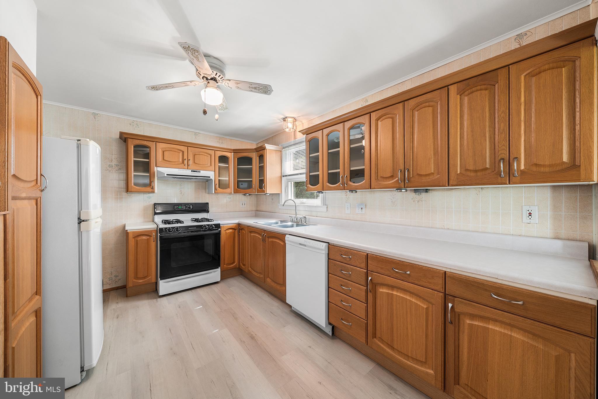 504 Lawrence Road Havertown, PA 19083 - Photo 13 of 20 a kitchen with stainless steel appliances granite countertop a refrigerator stove top oven and sink