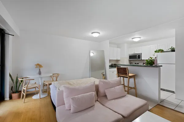 a bedroom with furniture and a flat screen tv