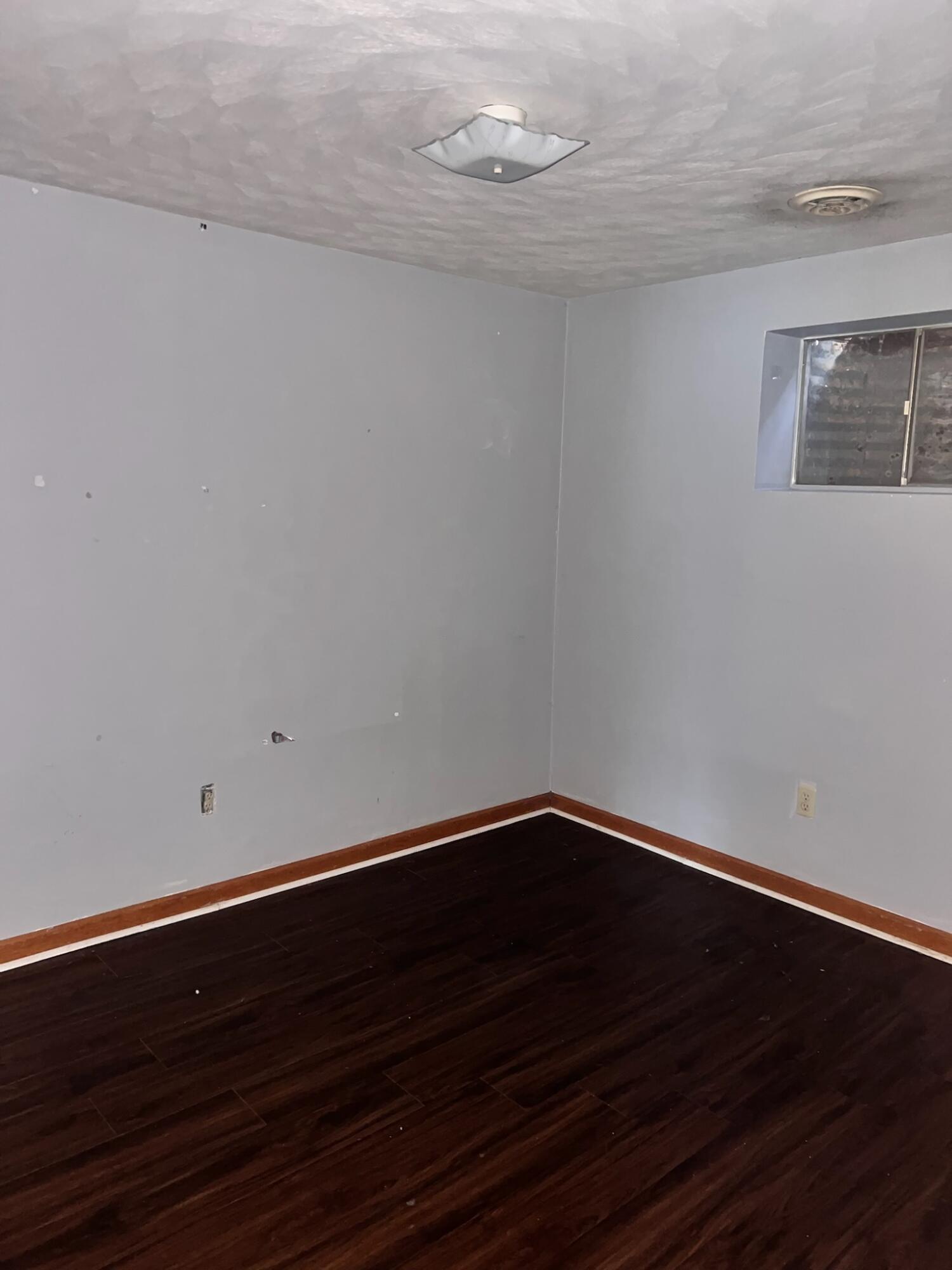 2126 Carvin Street Northeast Roanoke, VA 24012 - Photo 4 of 7 a view of an empty room with wooden floor