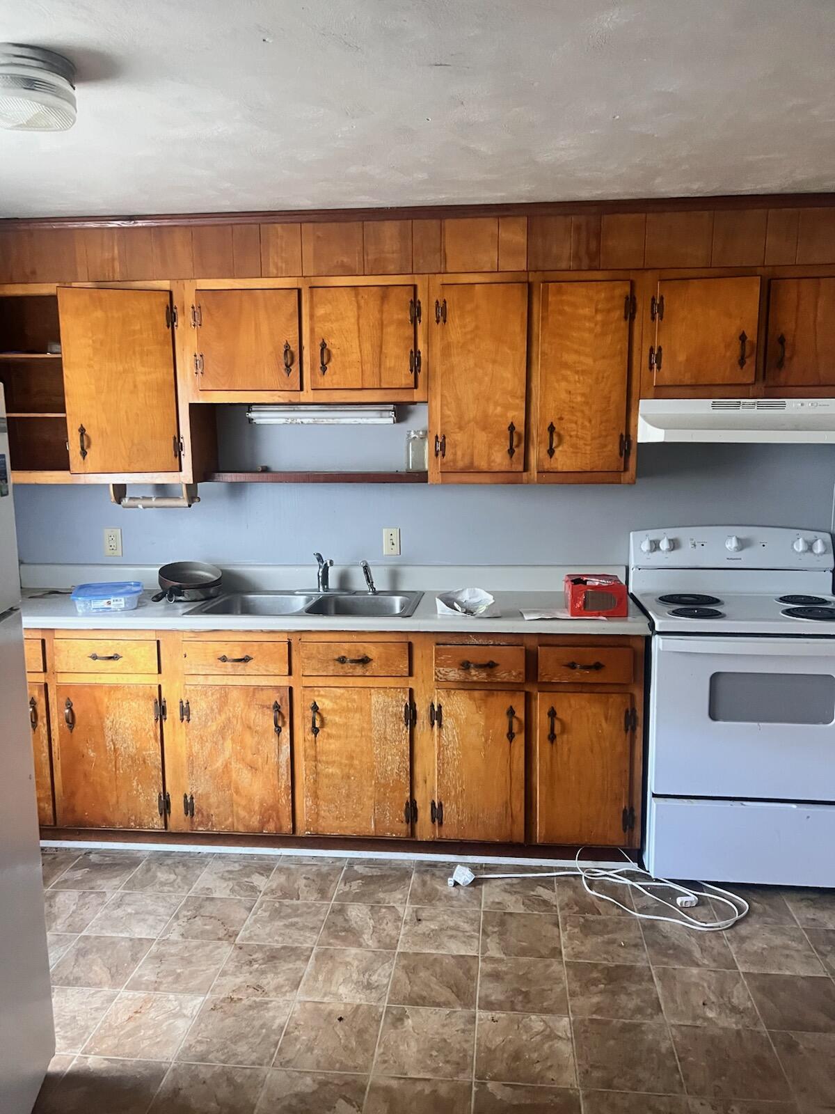 2126 Carvin Street Northeast Roanoke, VA 24012 - Photo 6 of 7 a view of kitchen with stainless steel appliances granite countertop a stove and a sink