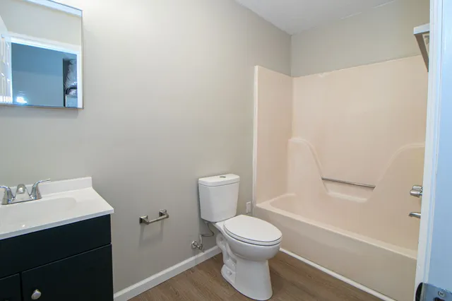 a bathroom with a shower and a toilet