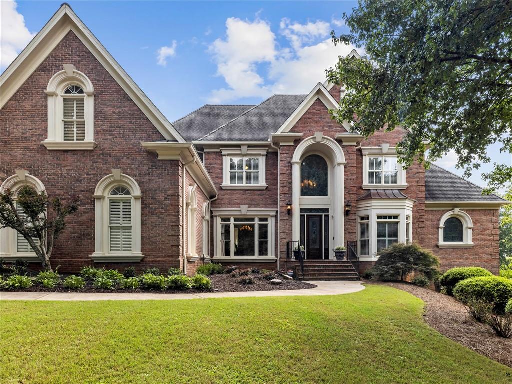 Beautiful four-sides brick home on golf course. 