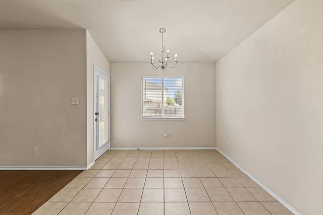 an empty room that has a window in it