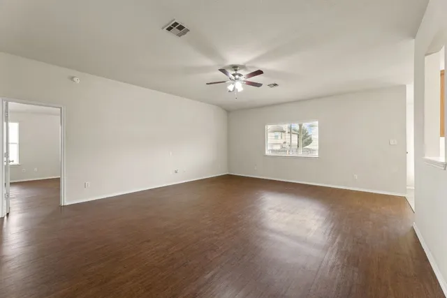 a view of an empty room with a window