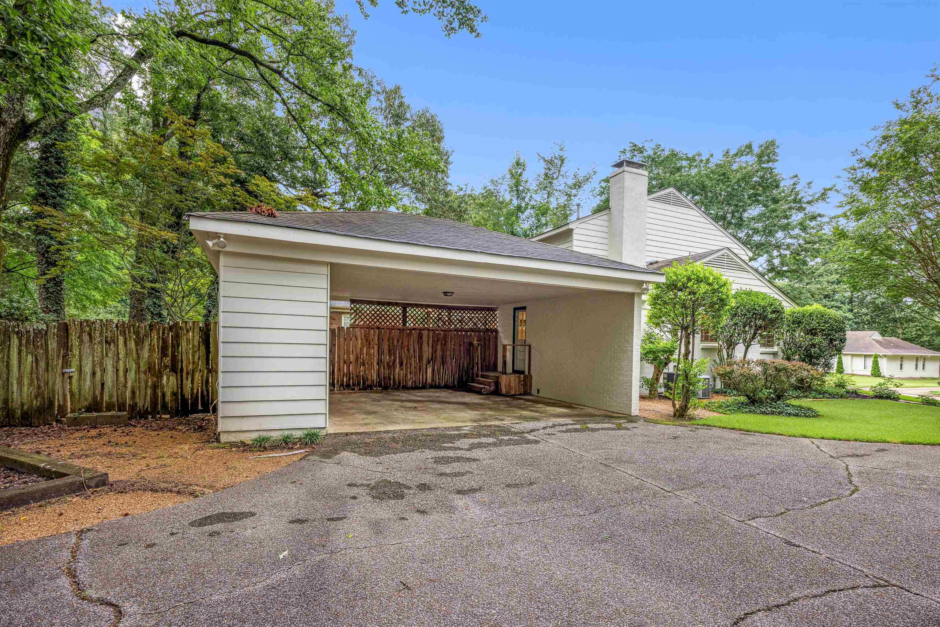 2030 Brierbrook Road Germantown, TN 38138 - Photo 16 of 16 Garage with driveway and a carport