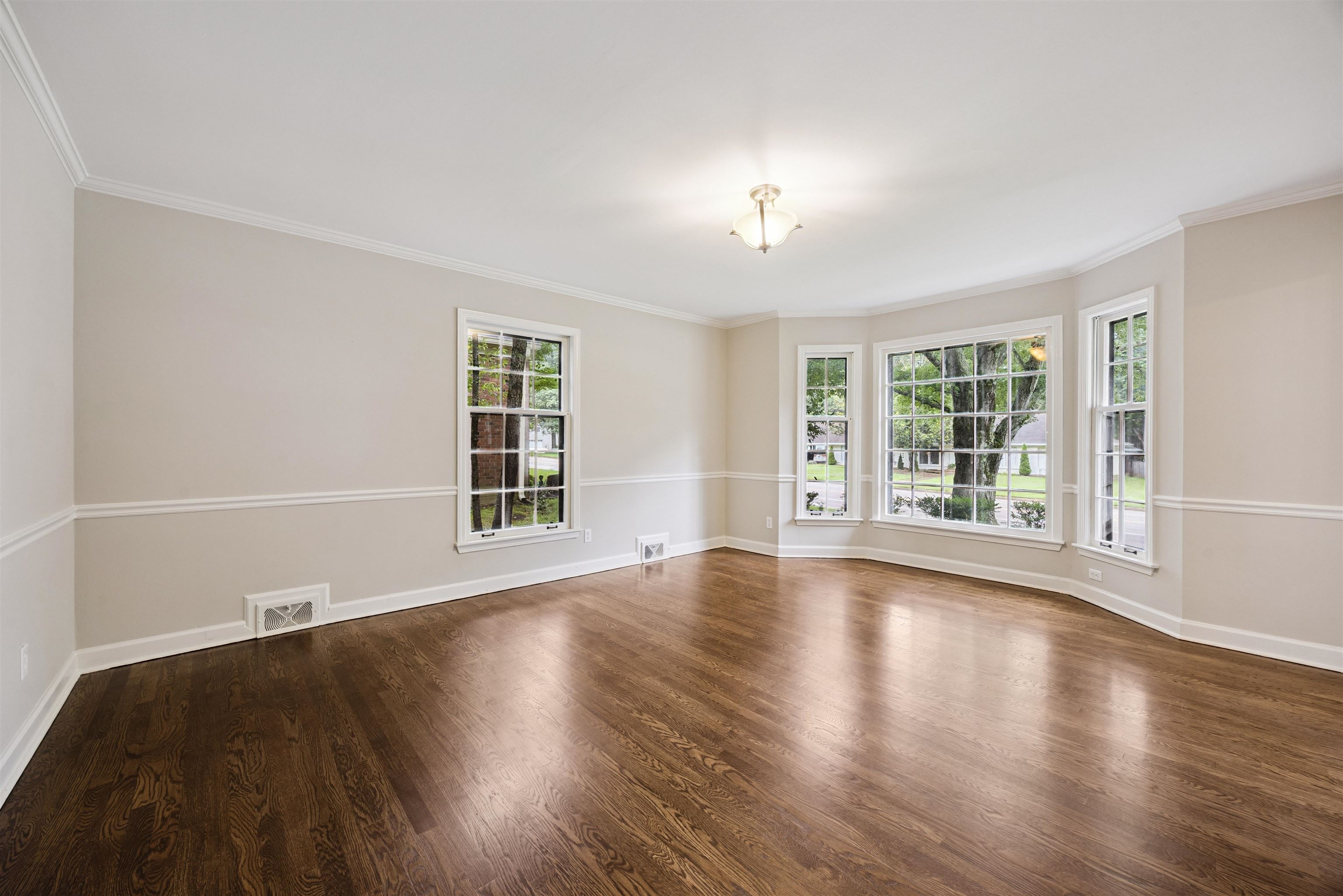 2030 Brierbrook Road Germantown, TN 38138 - Photo 2 of 16 Empty room with dark wood-style floors and crown molding
