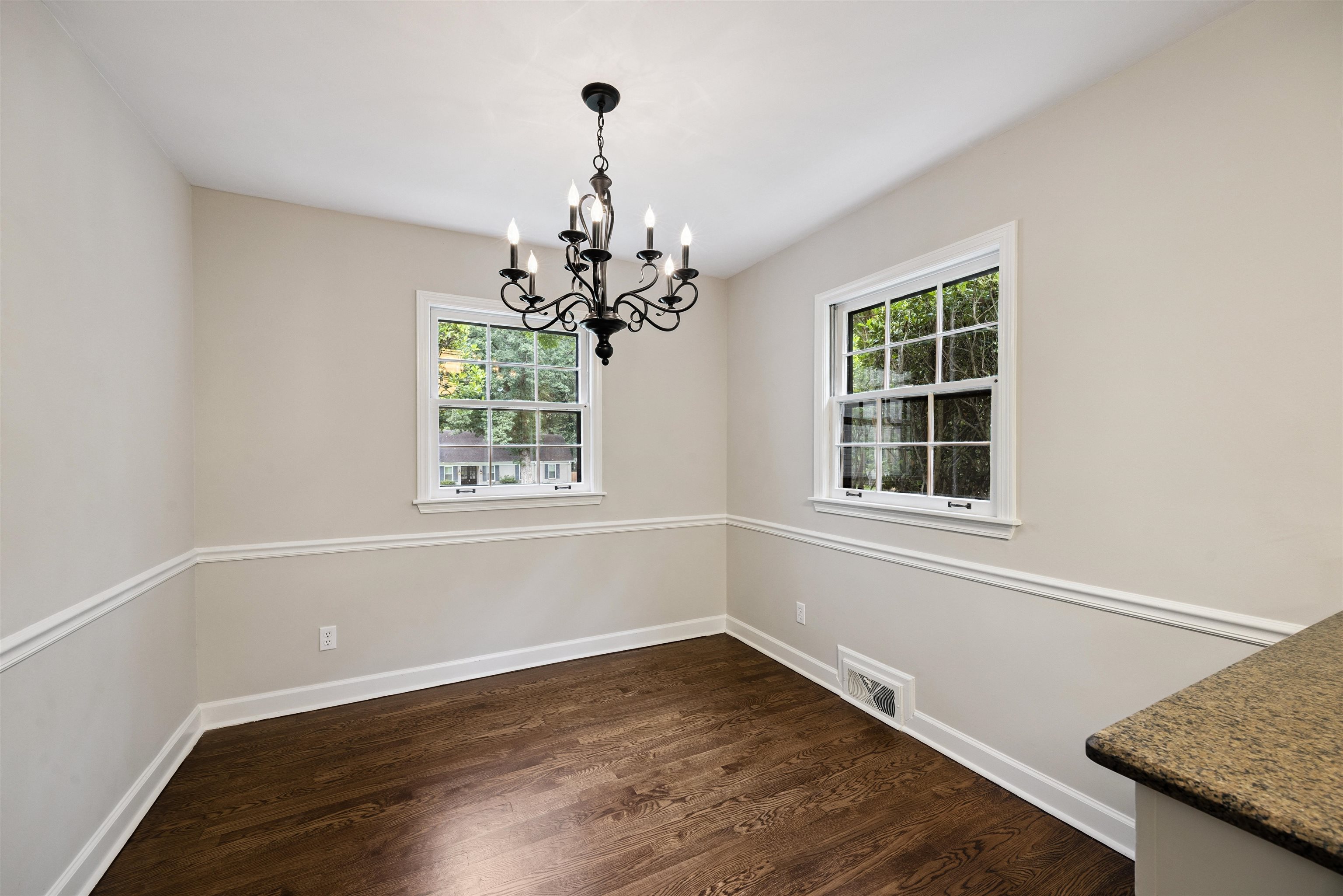 2030 Brierbrook Road Germantown, TN 38138 - Photo 9 of 16 Unfurnished dining area featuring dark wood finished floors, a chandelier, and healthy amount of natural light
