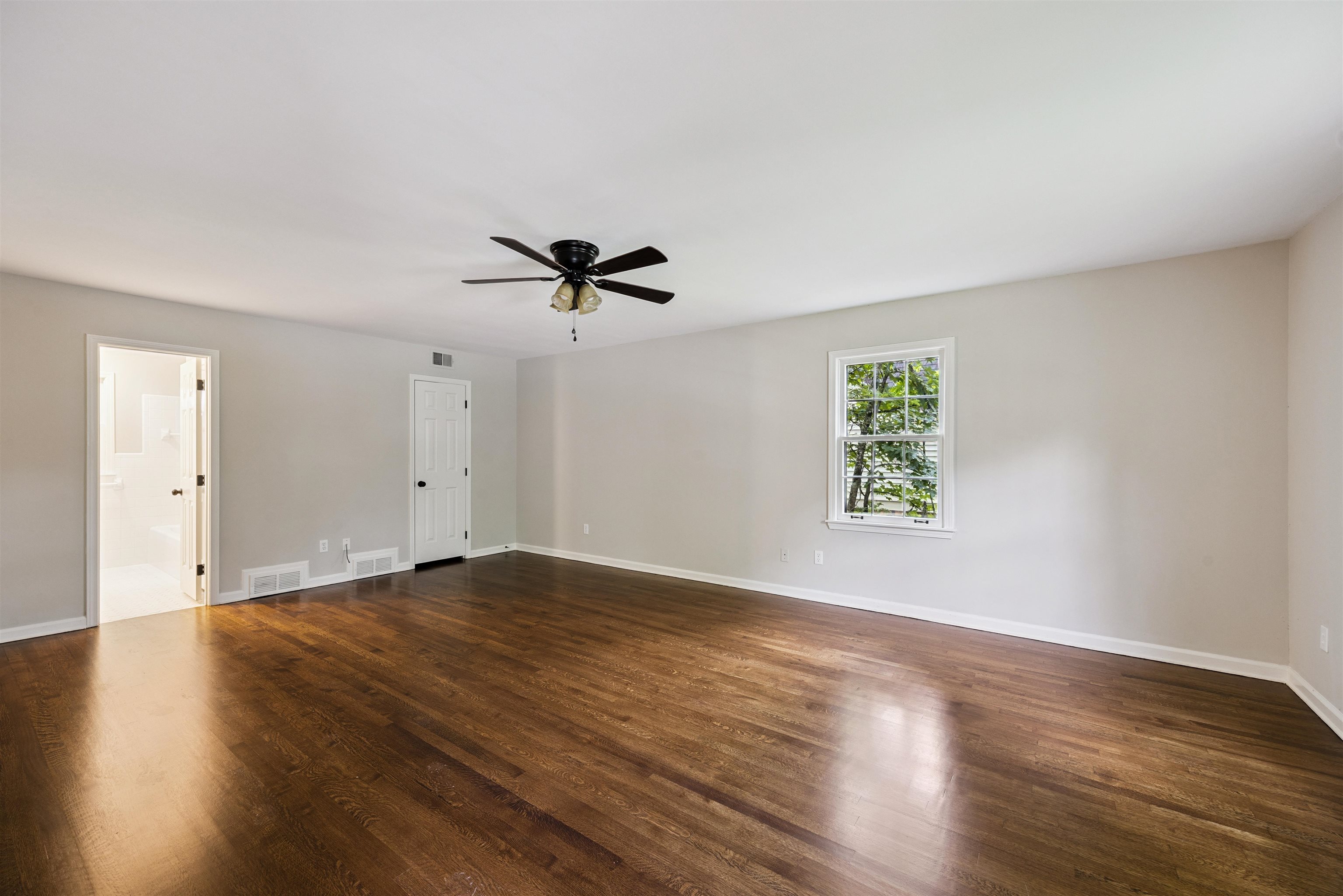 2030 Brierbrook Road Germantown, TN 38138 - Photo 10 of 16 Empty room with dark wood-style floors and ceiling fan