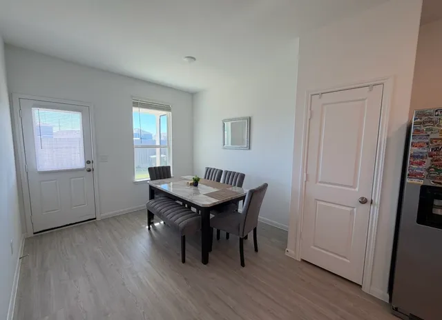 a view of a livingroom with furniture and wooden floor