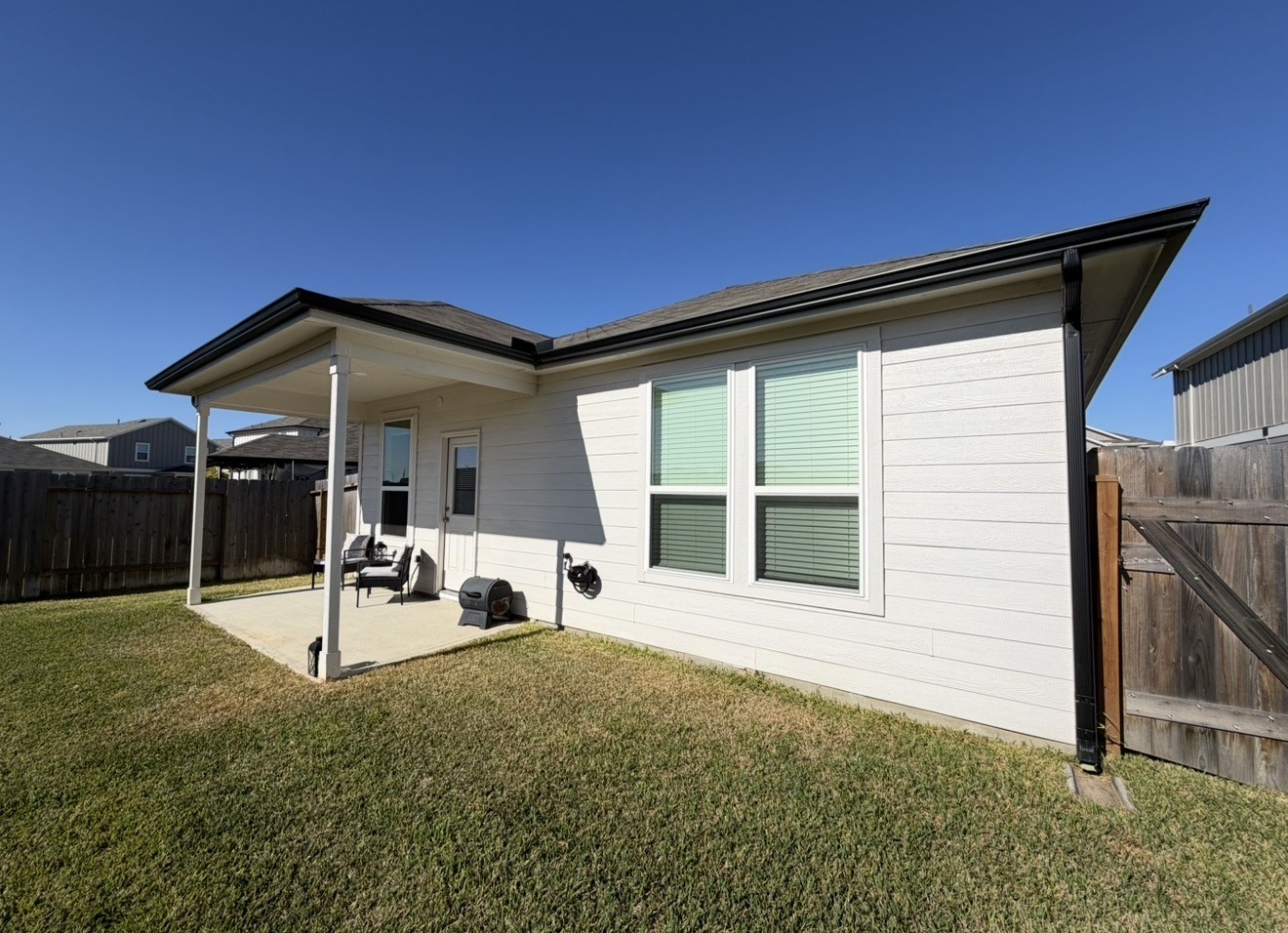 23415 Wagon Cart Road Hockley, TX 77447 - Photo 26 of 26 a view of a house with backyard and porch