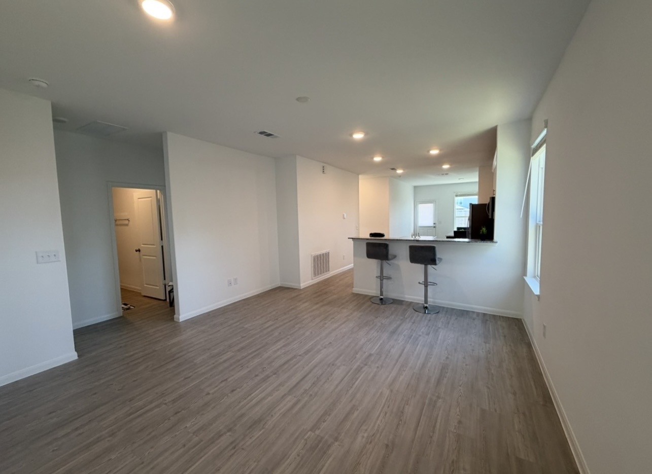 23415 Wagon Cart Road Hockley, TX 77447 - Photo 8 of 26 a view of a kitchen with a sink and a refrigerator