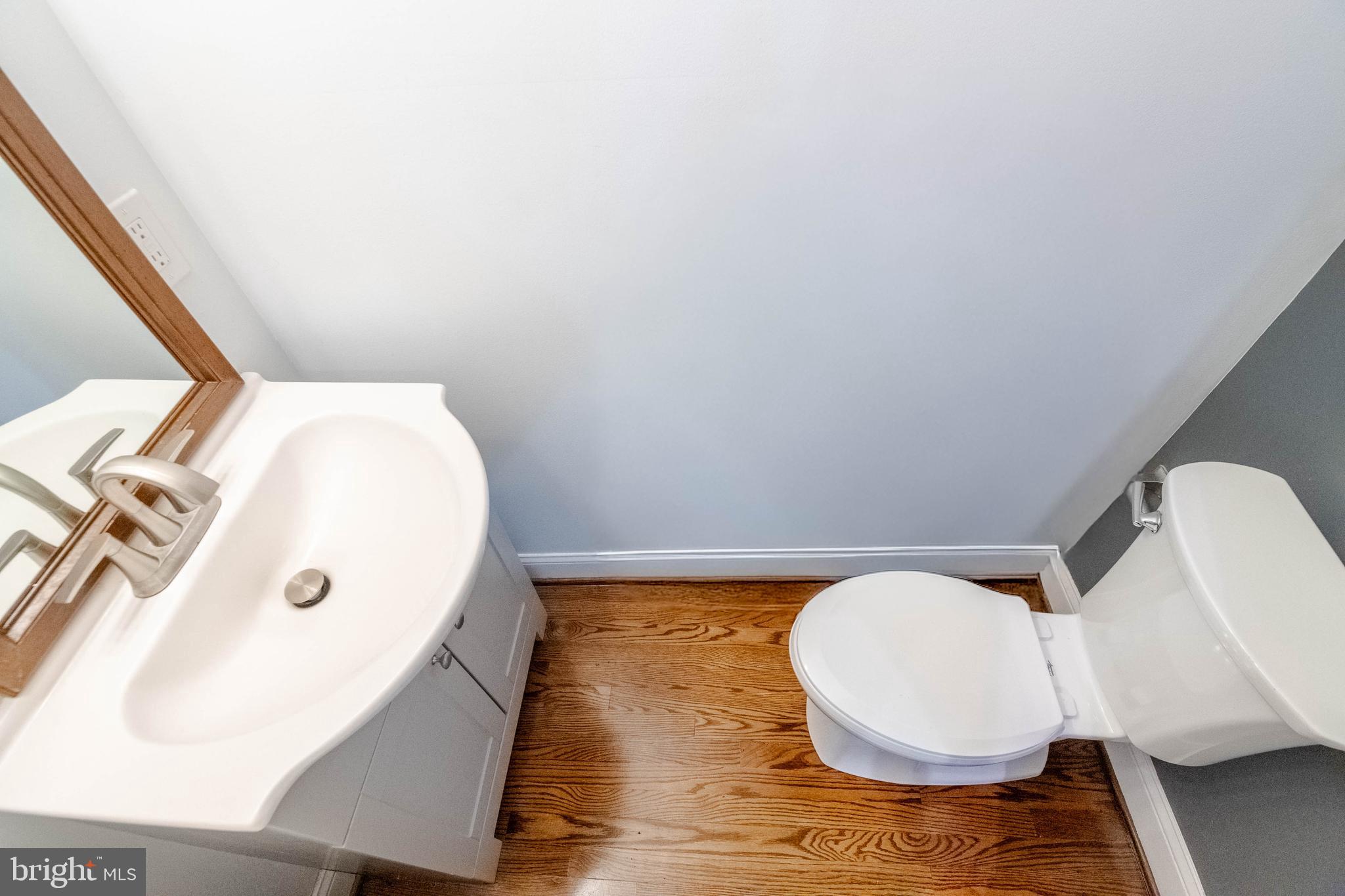 3004 Dunmurry Road Dundalk, MD 21222 - Photo 15 of 40 a bathroom with a sink and mirror
