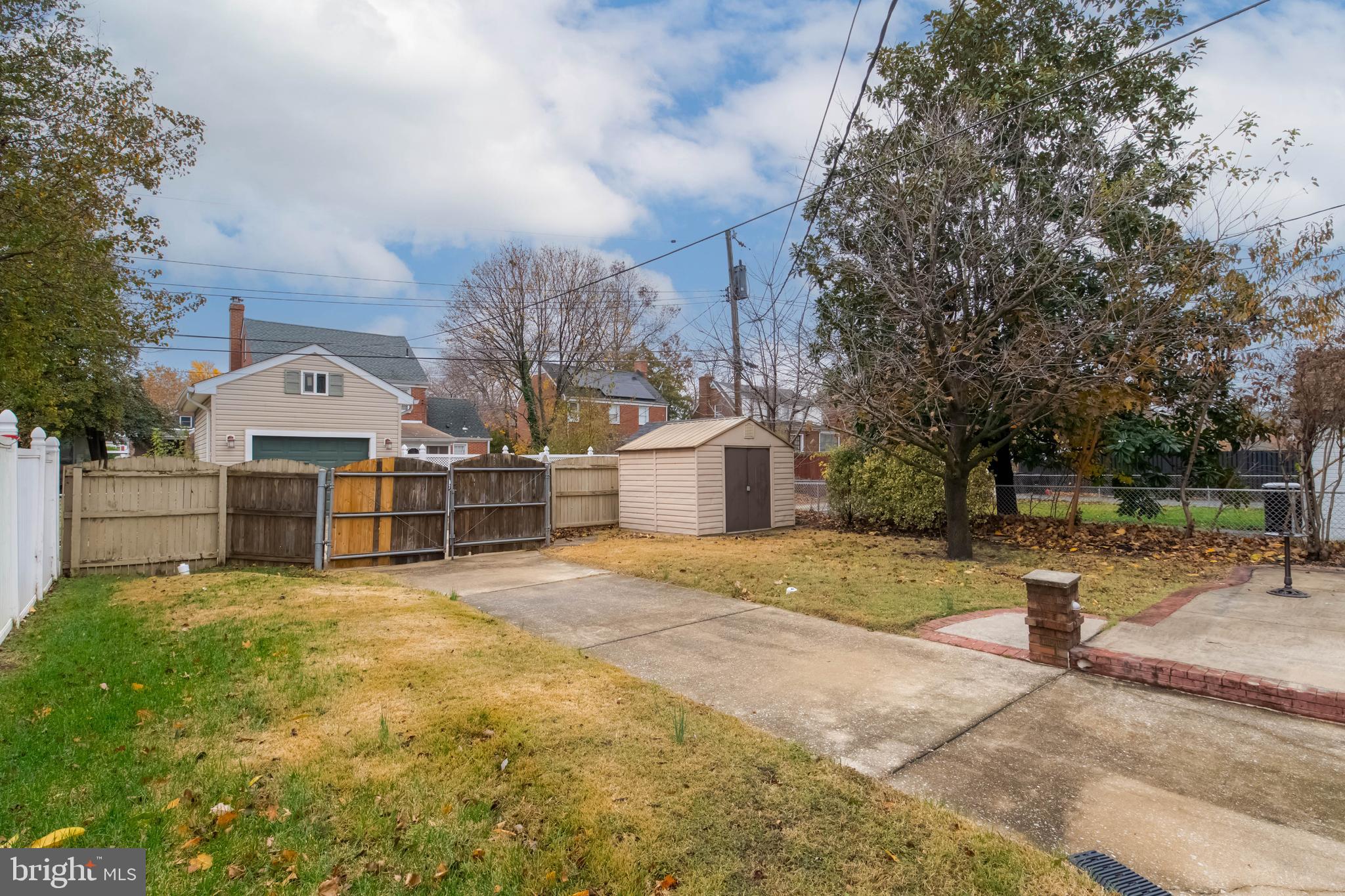 3004 Dunmurry Road Dundalk, MD 21222 - Photo 36 of 40 a view of a house with a big yard and large trees