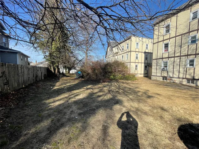 a view of a backyard of the house