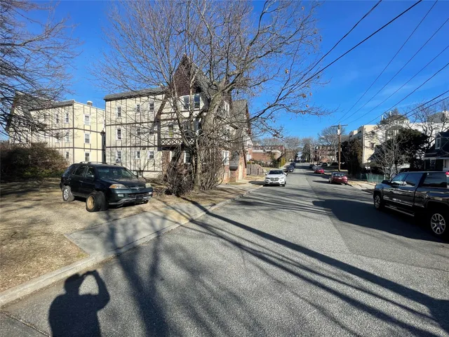 a view of a street with cars