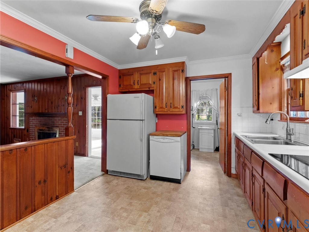 1803 Windsordale Drive Henrico, VA 23229 - Photo 13 of 46 Kitchen featuring brown cabinetry, white appliance