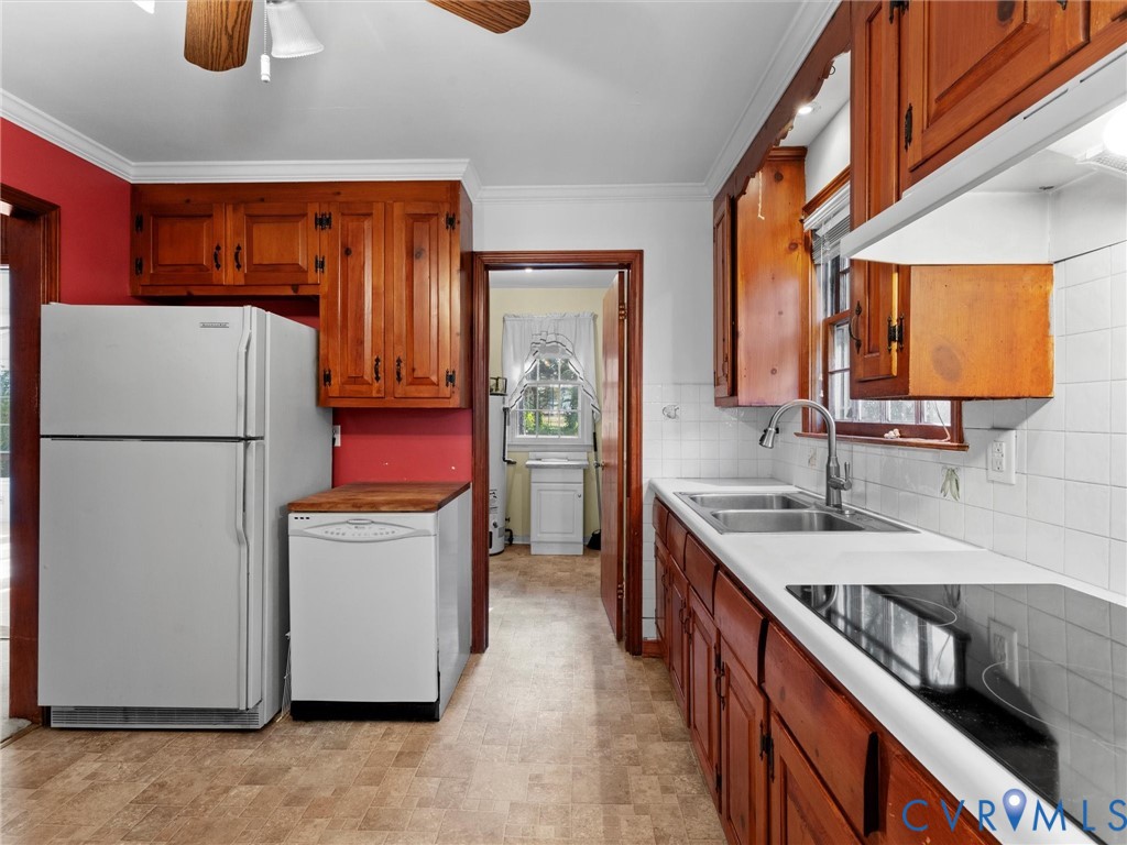 1803 Windsordale Drive Henrico, VA 23229 - Photo 17 of 46 Kitchen featuring brown cabinets, white appliances